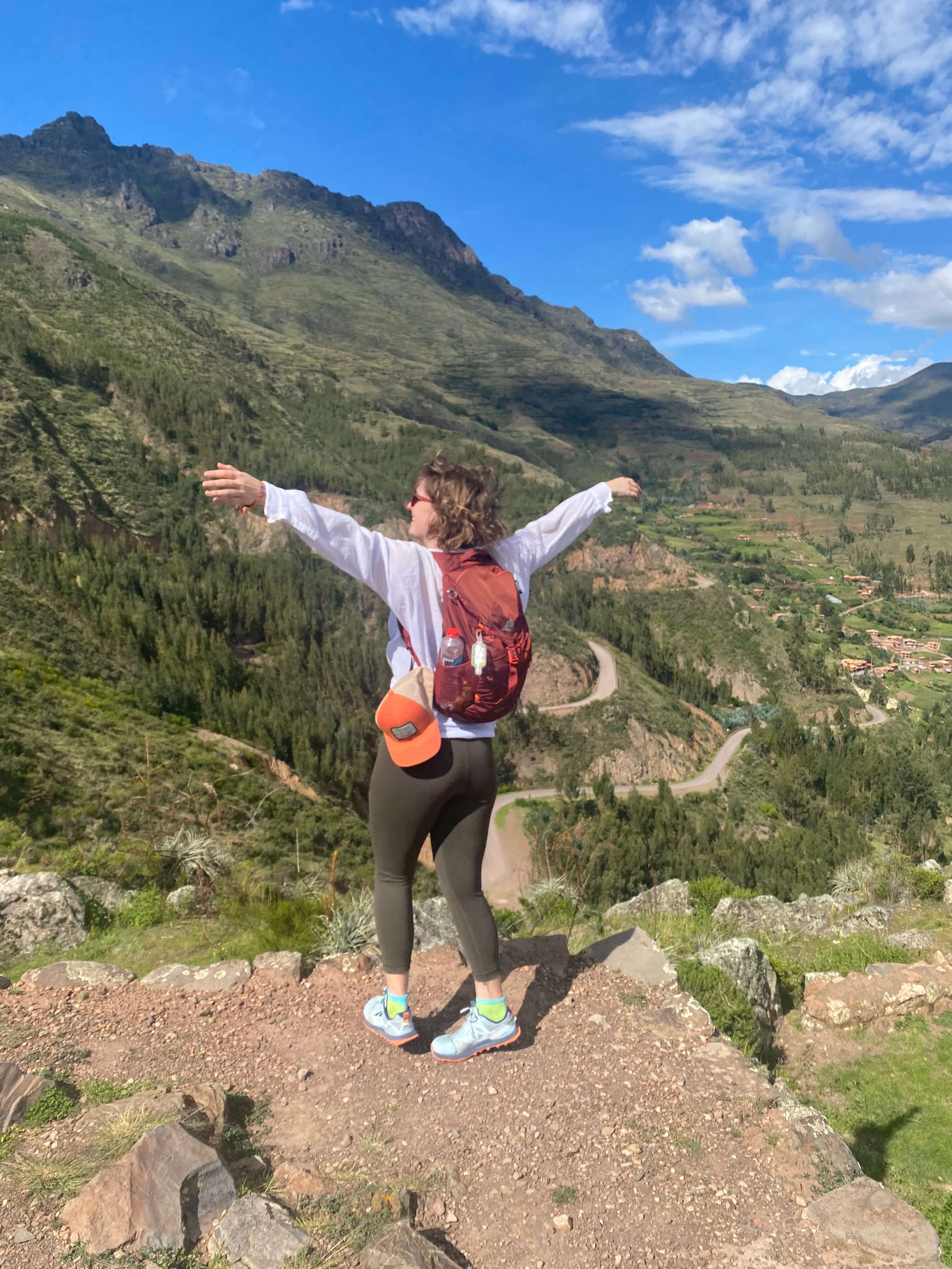 Me enjoying the winds whipping through the mountains in the Inkan ruins of Pisac, Peru